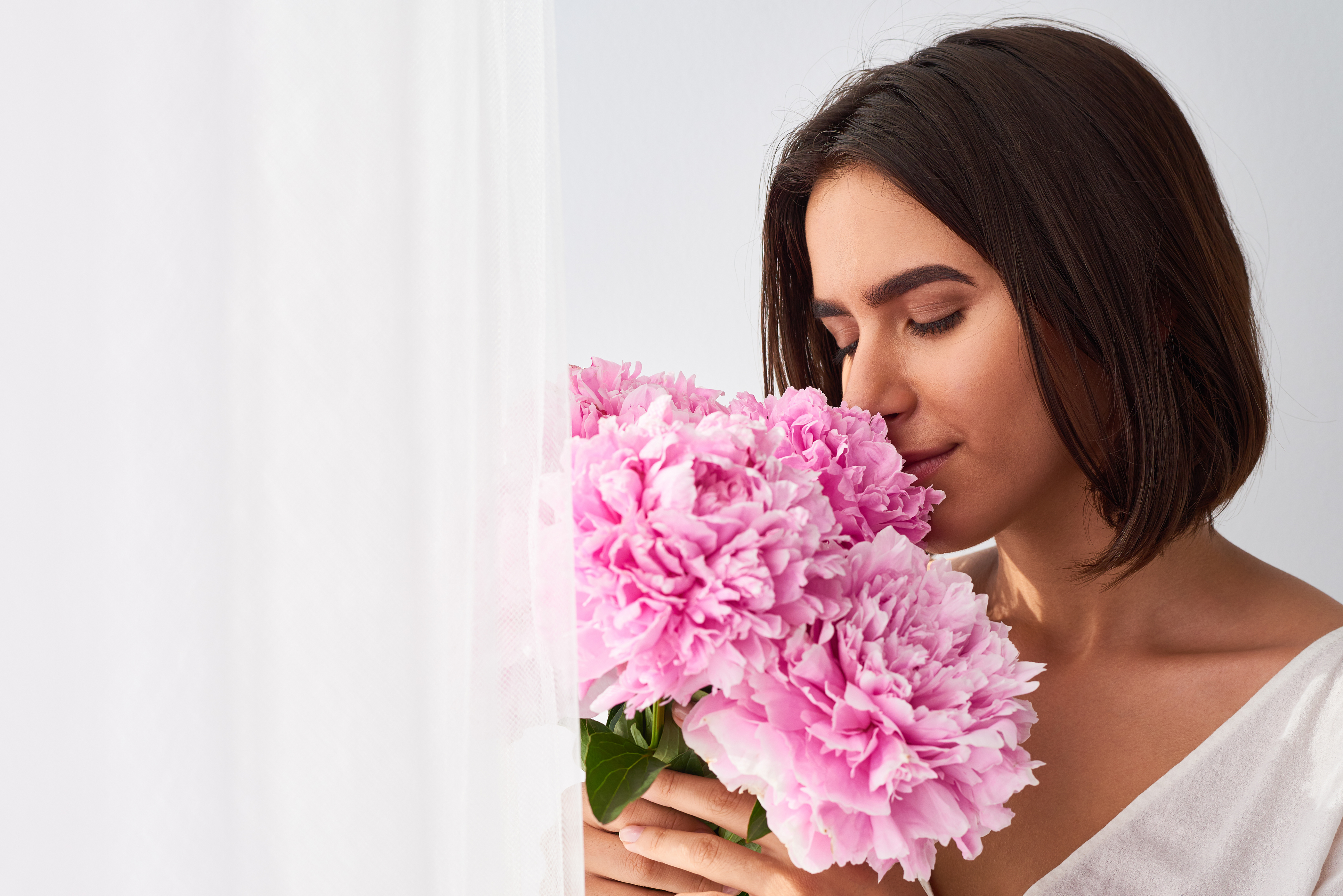 Beautiful Woman Smelling Flowers